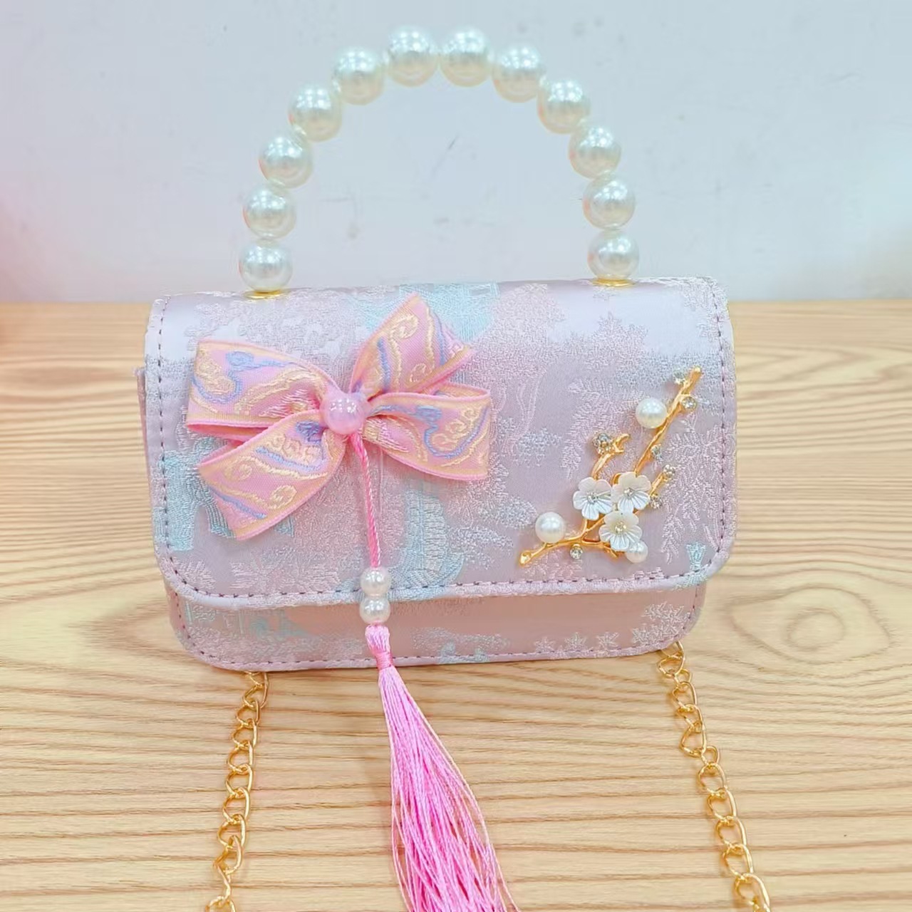 Bolsas de niños arco de estilo chino borda de niña pequeña princesa perla bolsa de cambio de mano al por mayor