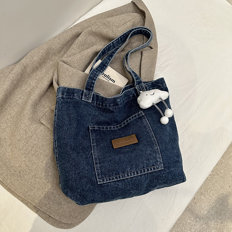 Bolsa de denim casual de gran capacidad para mujeres 2024 nueva bolsa de hombro de viaje, bolsa universitaria ligera y versátil
