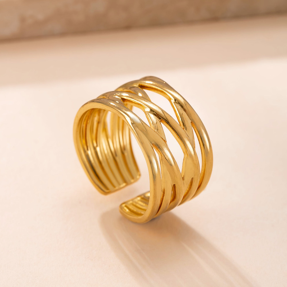 Anillo de acero inoxidable de moda europea y americana fundido anillo de apertura de línea irregular 18k chapado en oro viento frío joyería de acero de titanio