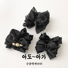 气质饱满低丸子头抓夹2025新款高端水钻蝴蝶结发夹女缎面夹子头饰