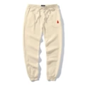 Beige pants with red label