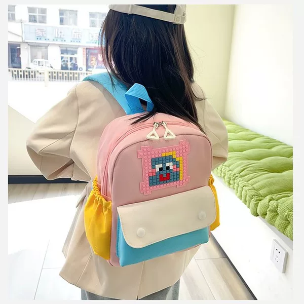 Korean-style boys' and girls' backpacks, fashionable cartoon color-blocking school bags, stylish and cute parent-child backpacks, new children's bags