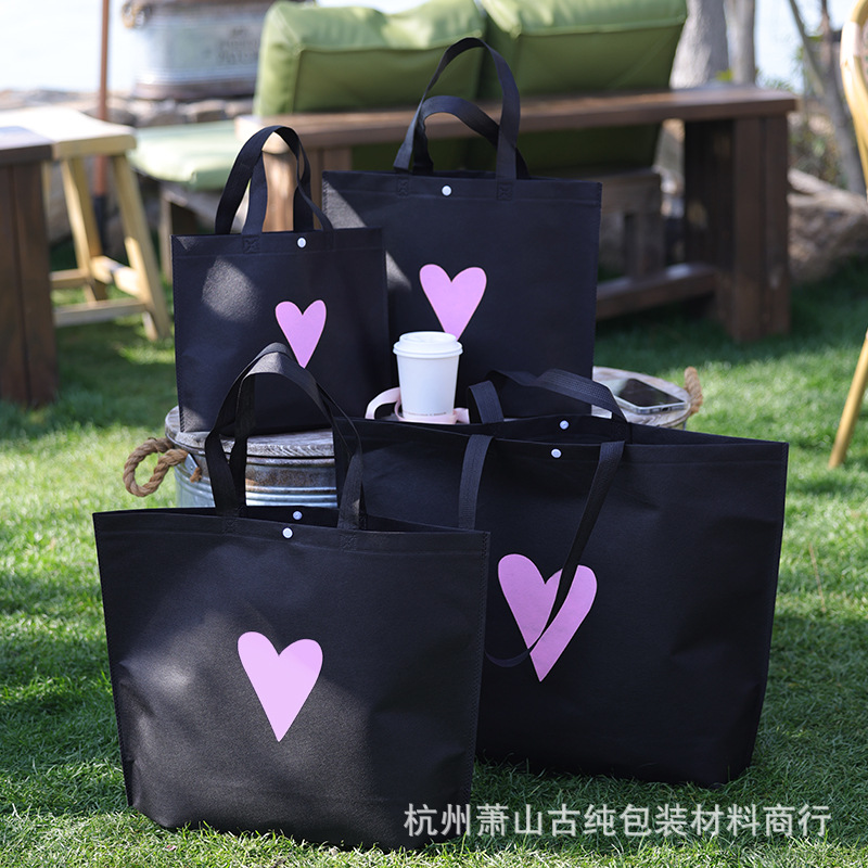 Bolso de mano no tejido de gran capacidad personalizado LOGO engrosado ropa de mujer protección ambiental bolsa de publicidad bolsa de compras de la tienda de ropa