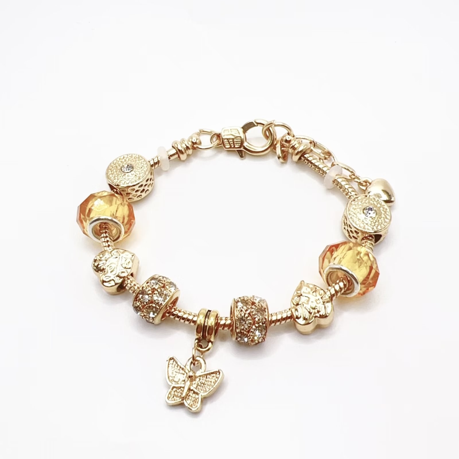 春夏の新型の小清新で甘い少女風のストライプの花の愛の蝶の数珠のブレスレットの透かし彫りのダイヤモンドの手の串