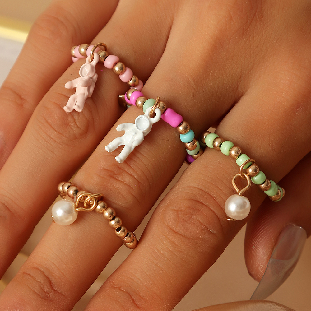 Simple Creative Spaceman Ring Color Rice Bead Elastic Tail Ring Set Ring display picture 2