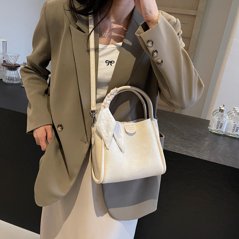 Cestas de verduras portátiles de moda simple 2024 nueva bolsa de mujer estilo extranjero versátil bolso de cubo de alta calidad nicho mochila