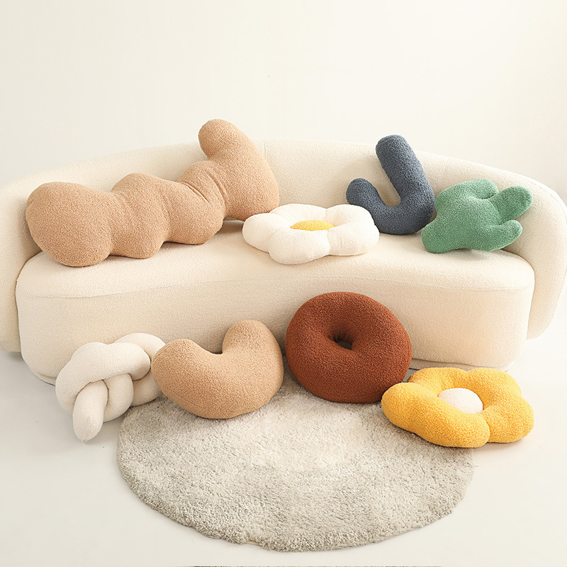 Nuevo estilo simple almohada de peluche floral almohada de peluche nudo donut almohada de cama almohada de cojín grande almohada al por mayor