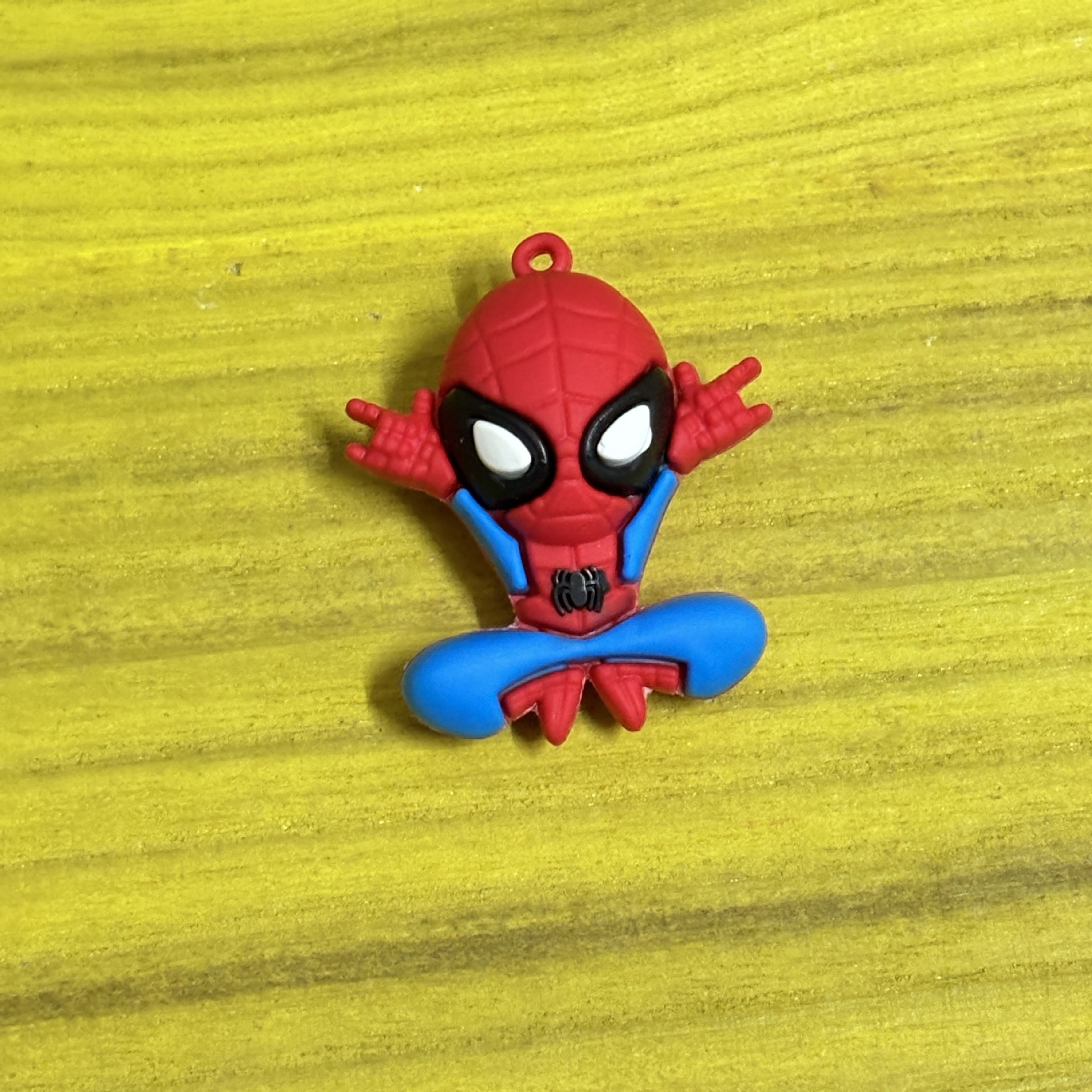 Single figure Spider-Man* squatting with hands raised