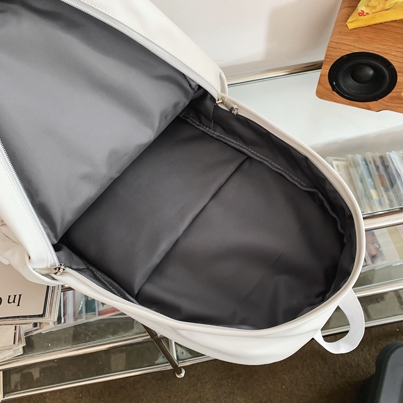 2023 invierno nueva mochila de pareja de gran capacidad simple y versátil mochila de computadora de viaje de cuero suave mochila escolar al por mayor