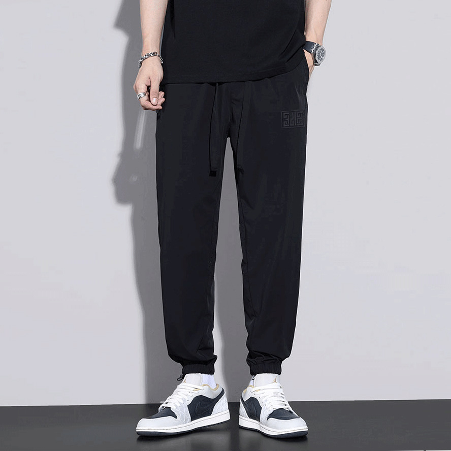 Pantalones casuales de seda de hielo, estilo fino de verano transpirable, secado rápido, marca de marea suelta, deportes harem, pantalones de ropa de primavera y otoño de nueve puntos para hombres