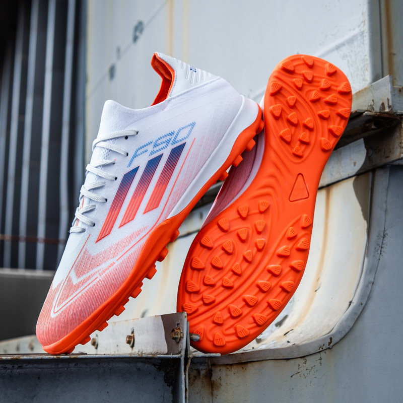 Putian sin costuras Copa de Europa F50 zapatos de fútbol zapatos deportivos de entrenamiento de uñas rotas AG de corte bajo para hombre