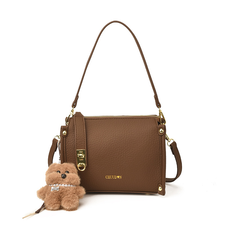 Bolsos retro retro de alta calidad para mujeres 2026 nueva textura lichi bolso pequeño estilo coreano simple mochila de hombro