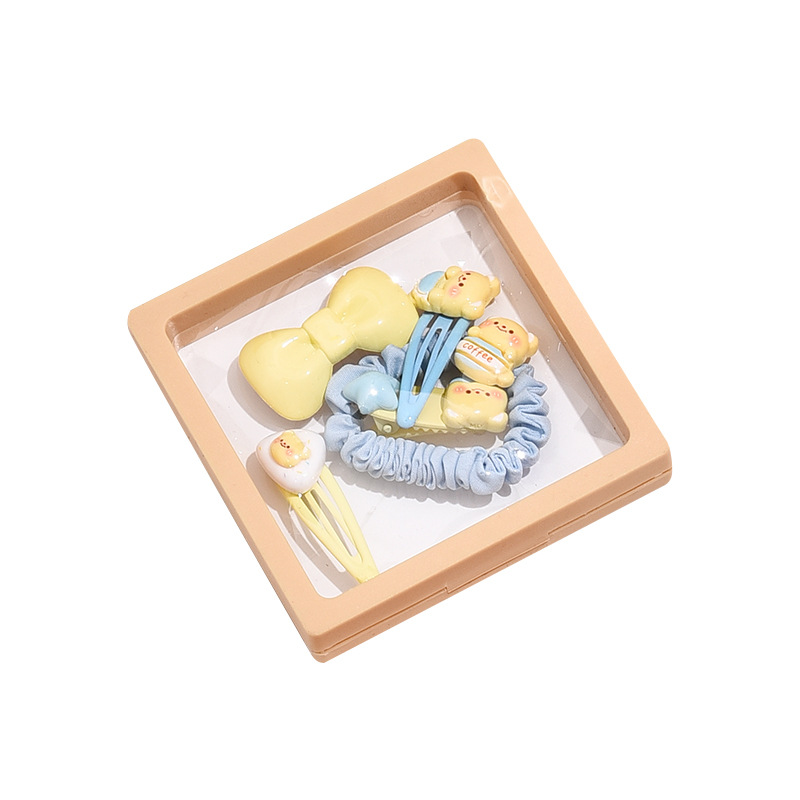 Linda combinación de accesorios para el cabello de la serie de osito amarillo lechoso dulce clip de flequillo de cabello roto de alta elasticidad lazo para el cabello al por mayor
