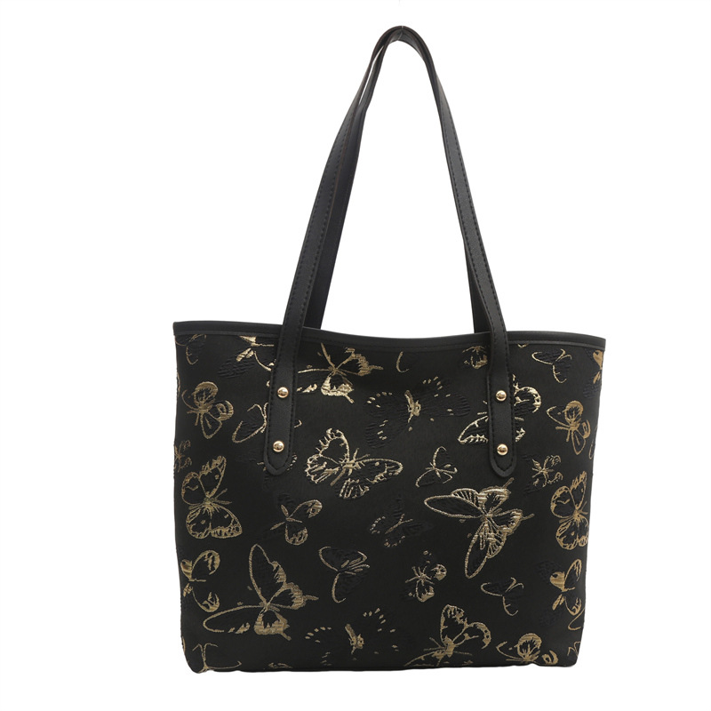 Nueva primavera y verano, nueva bolsa china de gran capacidad, estilo nacional de mariposa bordada bolsa de cubo, bolsa de hombro casual versátil.
