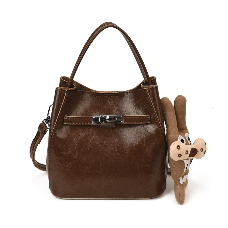 Bolso de viaje bolso de cubo de mano mujer 2025 nuevo otoño invierno alto sentido retro bolso de hombro relajado bolso de mochila