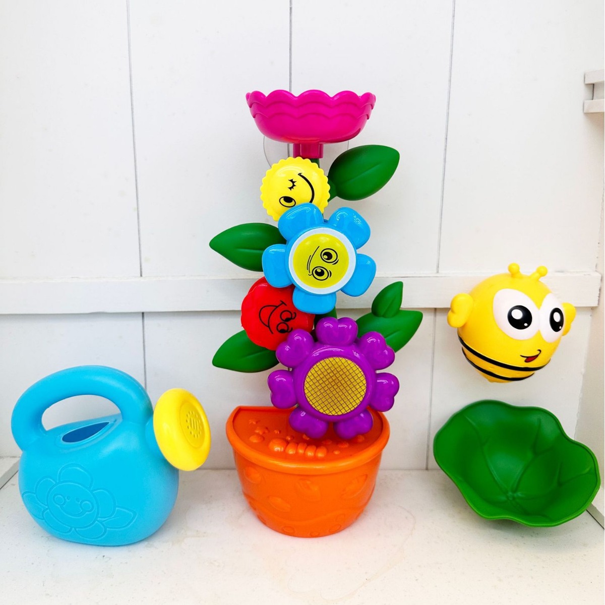 Divertidos juguetes de baño para niños transfronterizos, pequeño juguete giratorio de baño de jardinería, juguete para ducha de bebé, venta directa de fábrica.