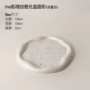 The tray is round ink splash white