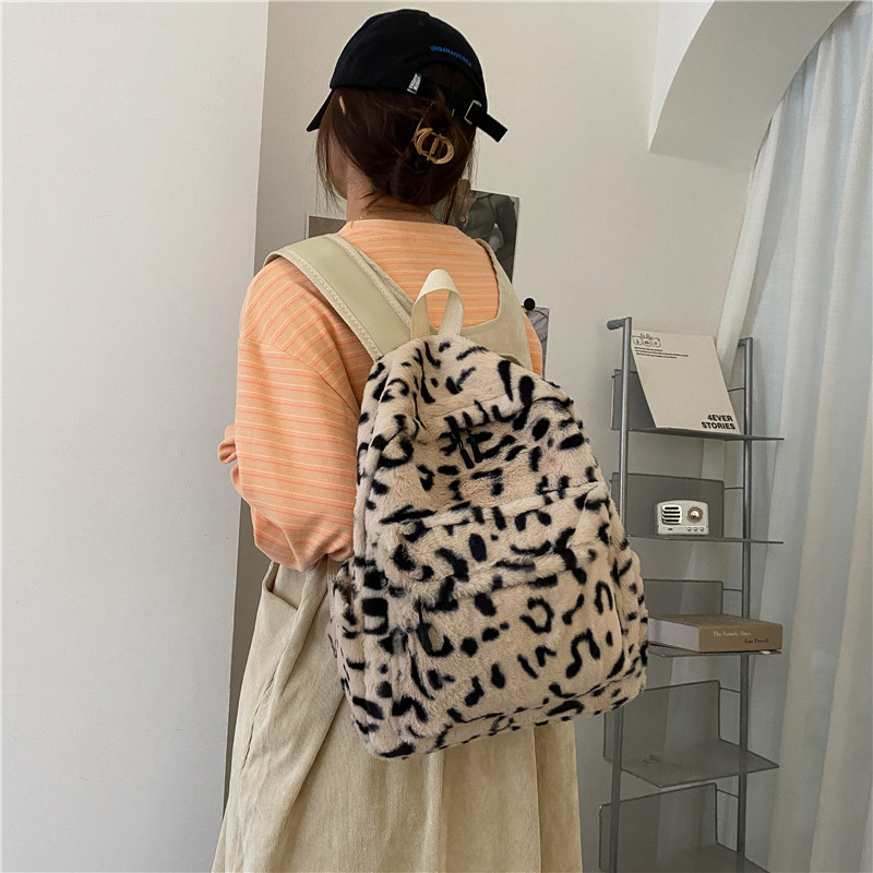 Mochila de moda estampado de leopardo bolsa de felpa para mujer 2022 invierno nuevo simple estudiante mochila para mujer