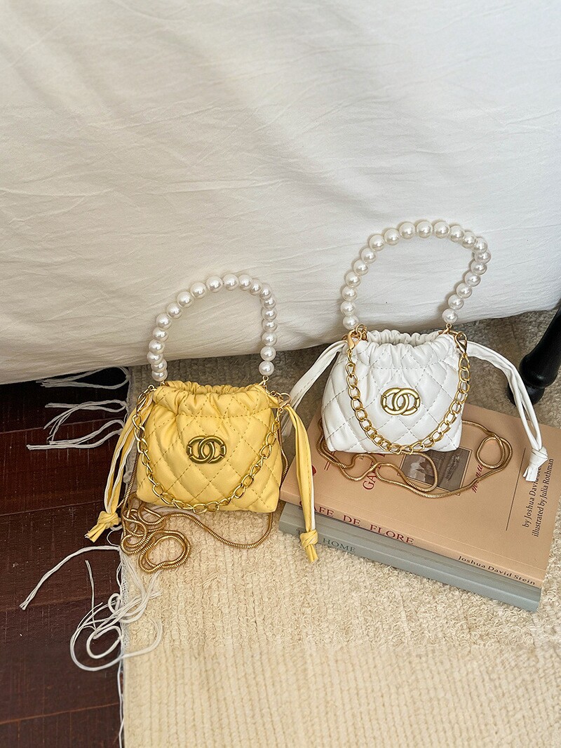 2026 nuevo niño cadena de perlas bolsos de diamante chicas moda mini bolsos de hombro caramelo princesa mochila