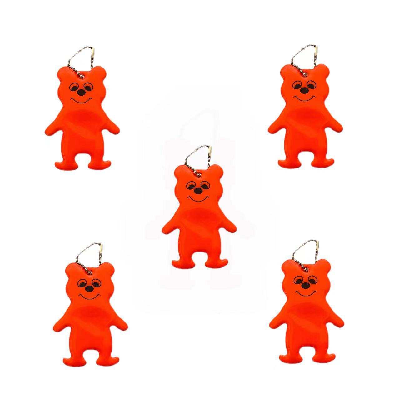 Fabricantes de procesamiento de colgantes reflectantes modelado oso colgantes reflectantes PVC llavero colgante