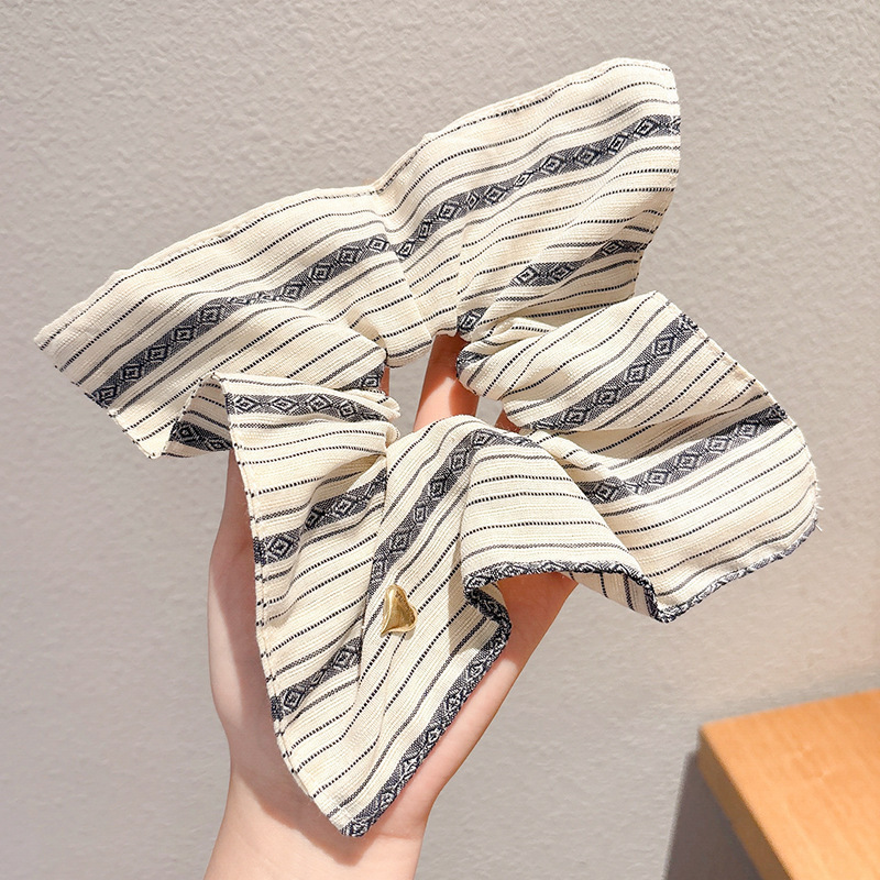 Pastoral viento intestino anillo de cabello mujer 2025 nuevo estilo de alta sensación bola de cabello cuerda de cabeza flor dulce princesa adornos de cabello cuerda