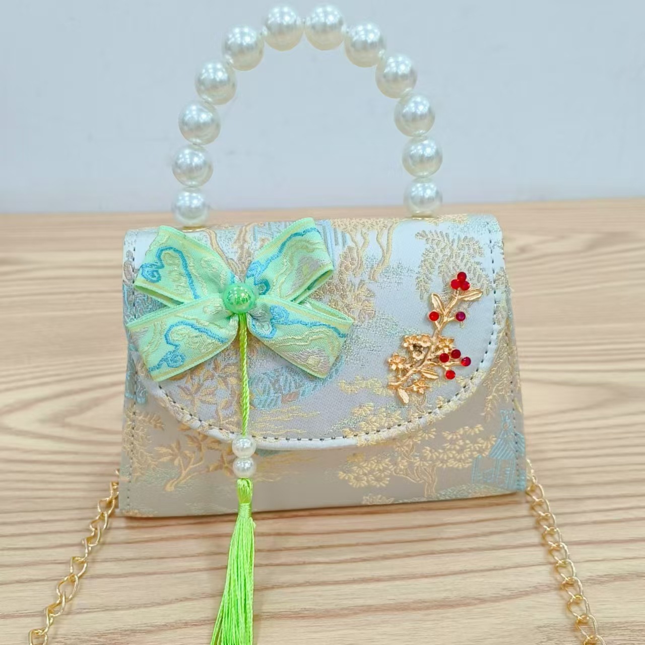Bolsas de niños arco de estilo chino borda de niña pequeña princesa perla bolsa de cambio de mano al por mayor