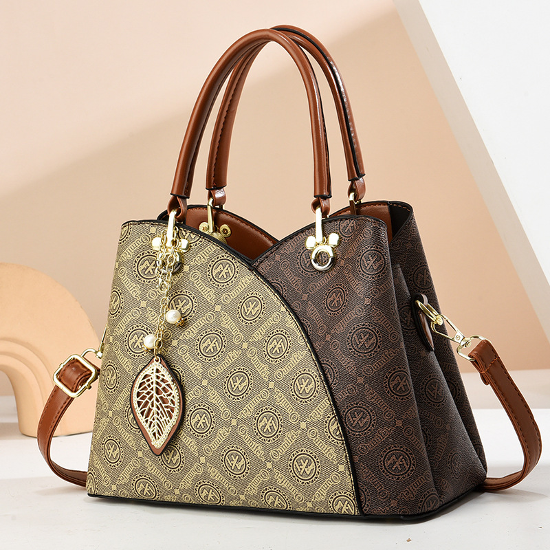 2025 verano nuevo bolso de moda de mediana edad bolso de mujer bolso de hombro mochila atmósfera bolso de madre universal