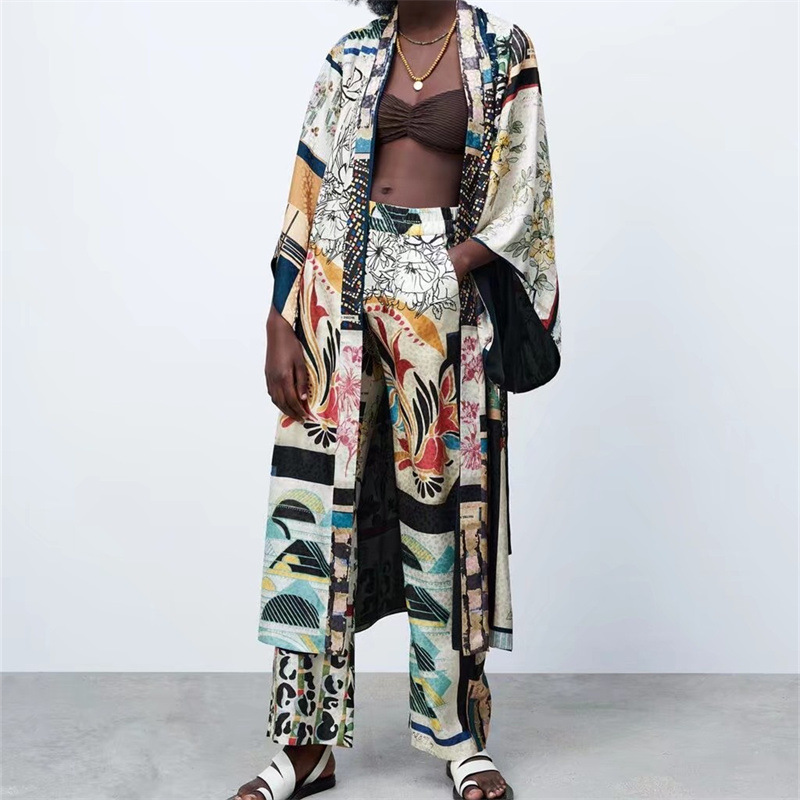 Wholesale European and American style women's clothing, 2022 summer niche printed patchwork kimono coat + wide-leg trousers set.