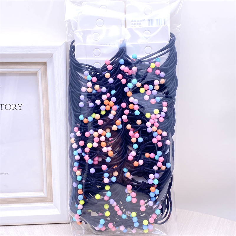 La versión coreana de la tarjeta colgante de té leche adornos de cabello nudo cinta de cuentas de cuerdas de alta elasticidad cuatro en uno correa de goma 2 tienda