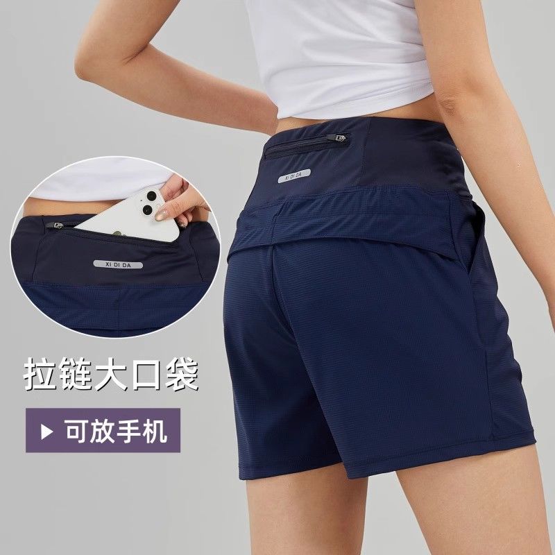 Pantalones cortos deportivos de mujer hielo rápido secado bolsillo de cintura trasero puede poner el teléfono móvil yoga pantalones casuales sueltos corredores cortos comercio exterior
