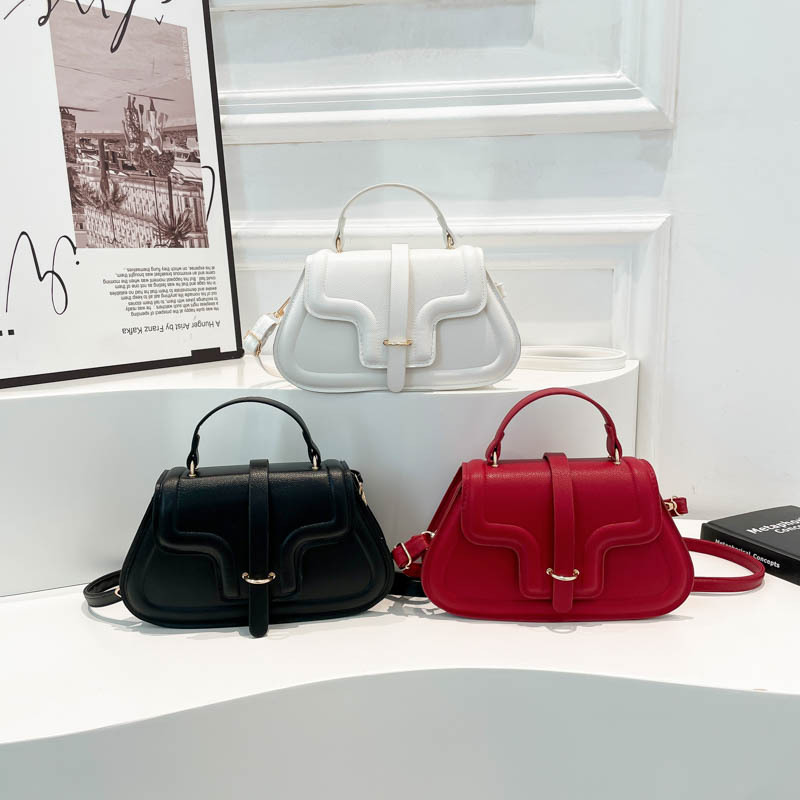 Simple bolso de mano de estilo extranjero para mujeres 2025 primavera nuevo cinturón de moda bolso de mujer nicho diseño mochila