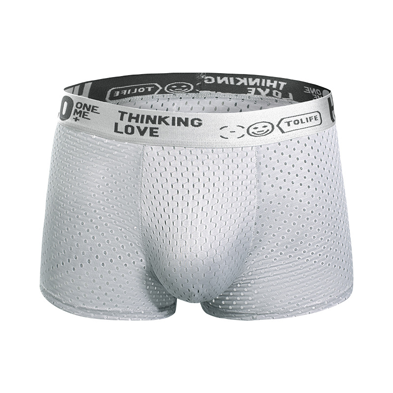 Pantalones interiores de hombre, agujeros de ojo de malla de hielo antibacteriana, entrepierna de ángulo plano, pantalones cortos delgados y cómodos, pantalones de cuatro cuartos para hombres al por mayor.