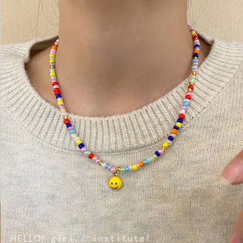 New year's new color beaded smiley sweatshirt necklace women's high-end design niche hot girl clavicle chain accessories