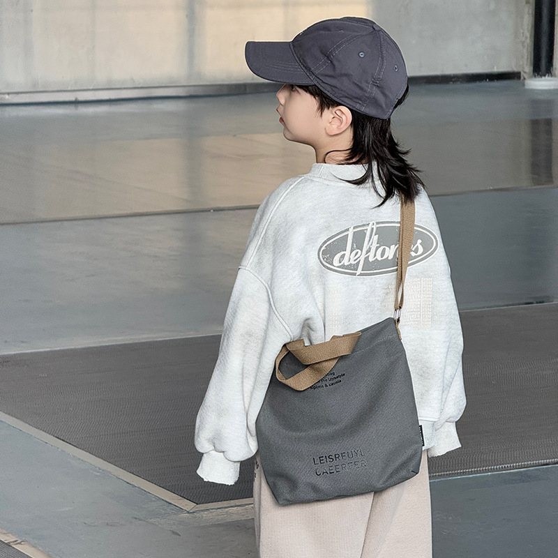 Bolso para niños con letras de estilo occidental Bolso de clase simple y ligero para estudiantes 2025 nuevo bolso de lona para niños y niñas