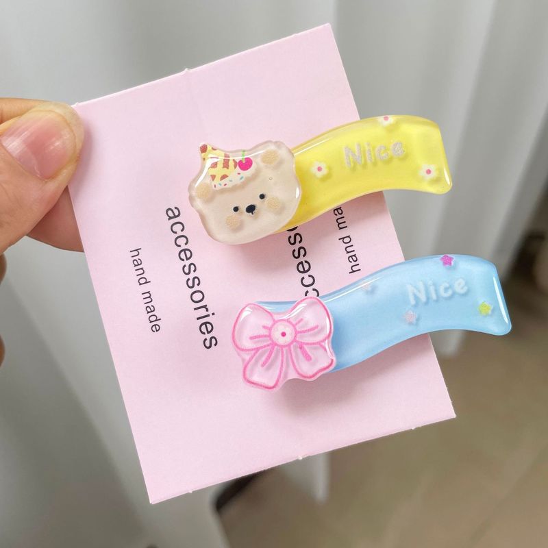 ネットの赤い漫画のヘアピンの子供のロットの高級感のヘアピンのバッチは屋台を並べてかわいいサイドの前髪のアヒルの口の砕いたヘアピンを売ります。|undefined