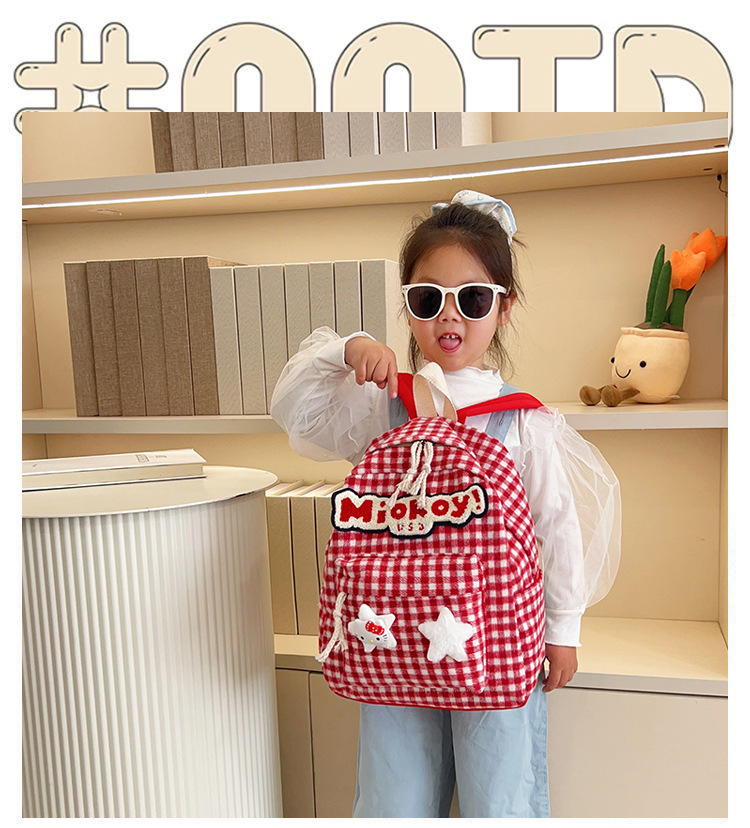 The large-capacity red woolen checkered backpack for primary and secondary school students is a unique and versatile choice. It's a trend for girls to carry backpacks during their leisure trips full figure
