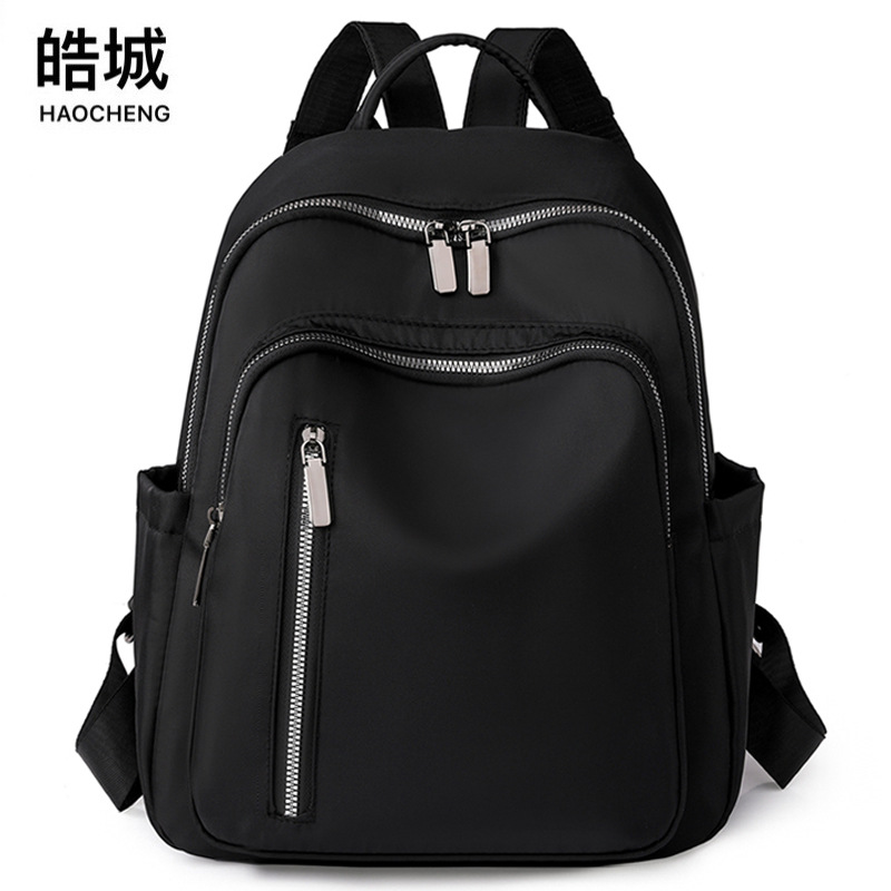 2023 nueva mochila de nailon para mujer coreana, mochila de viaje de gran capacidad para viajeros urbanos de todo fósforo de moda al por mayor