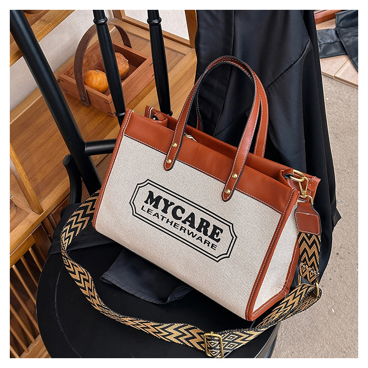 Bolso tote de gran capacidad, bolso de mano para clase y viajes, el popular bolso bandolera con estampado de letras de moda de este año.