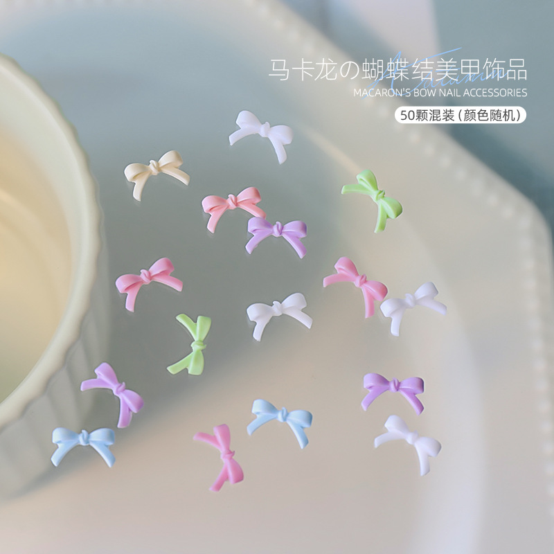 Macaron de estilo explosivo mini nail art bowknot joyería mezclada grande y pequeña resina simple accesorios de armadura al por mayor