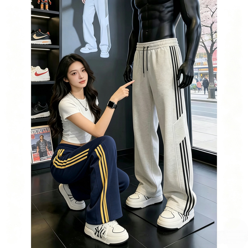 American-style three-stripe patchwork navy blue sports pants for men, with a stylish drape and striped straight-leg design, suitable for fitness and casual wear