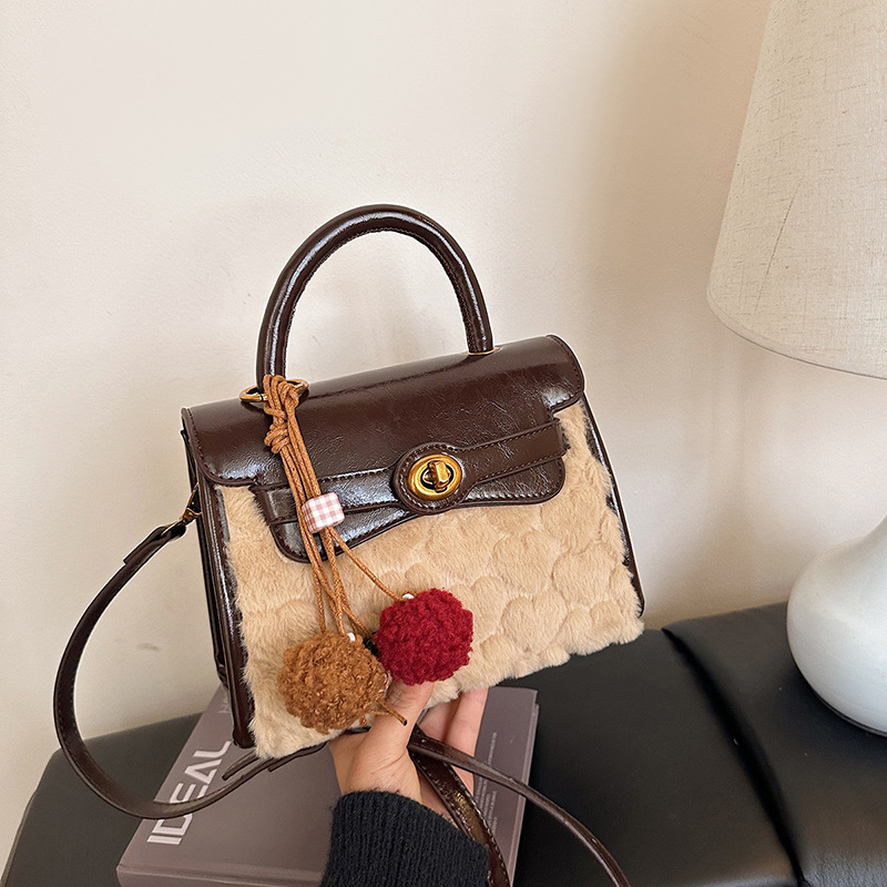 Otoño y invierno de alto nivel bolso de lana portátil para mujeres 2025 nuevo nicho Zhong commuting bolso de hombro bolso casual Kelly