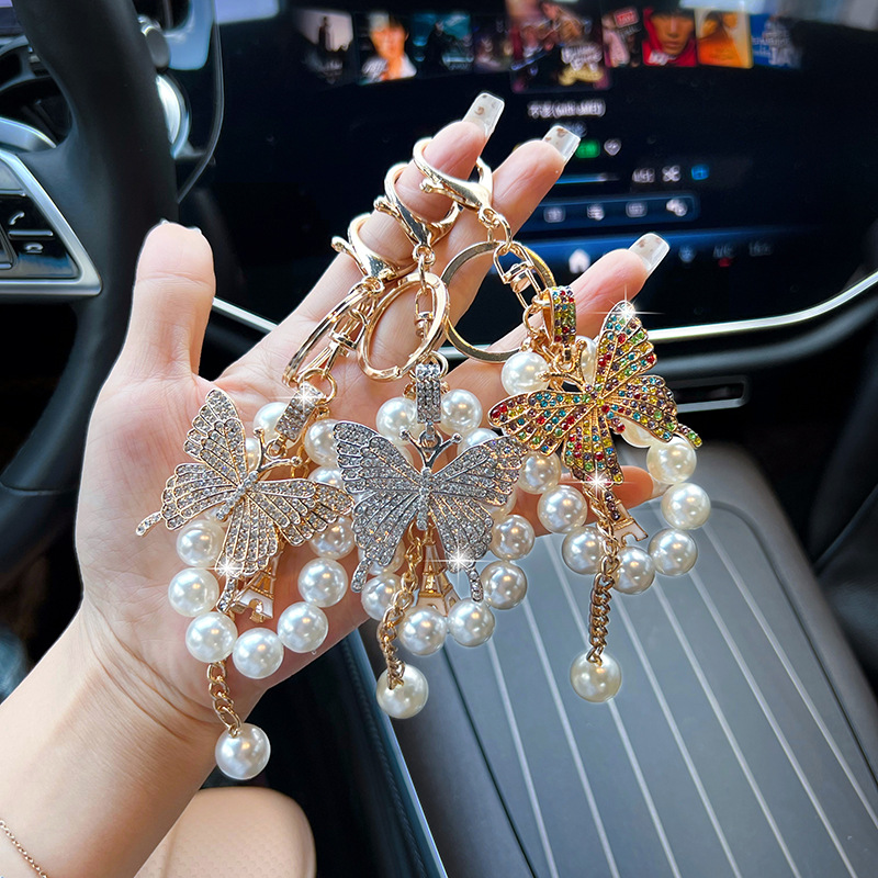 Nuevo tipo de aleación de cadena de perlas mariposa llavero de llavero de automóvil exquisito bolso coreano decoración exquisita colgante mujer