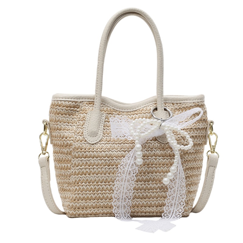 Bolso de cubo portátil de paja de gran capacidad de tendencia para mujer 2025 nuevo bolso de mensajero de hombro de moda de viaje de vacaciones en la playa