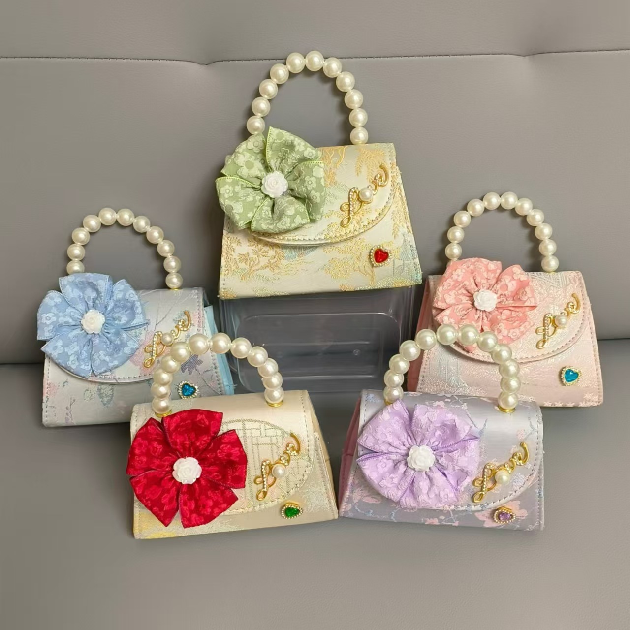 Bolsa infantil nueva niñas bolso de hombro accesorios de ropa china bolso cuadrado princesa bolso de perlas bolso arco bolso de mochila