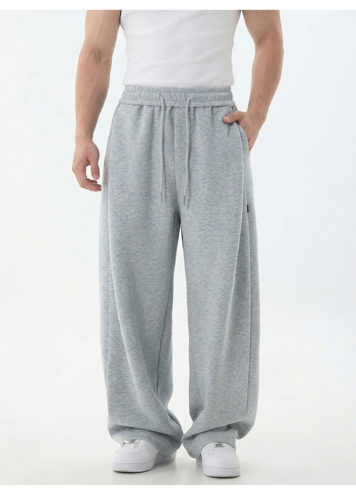 Pantalon de jogging pour homme à empiècements texturés, coutures asymétriques modernes, entrejambe basse, coupe décontractée, tombé impeccable._voghion.com