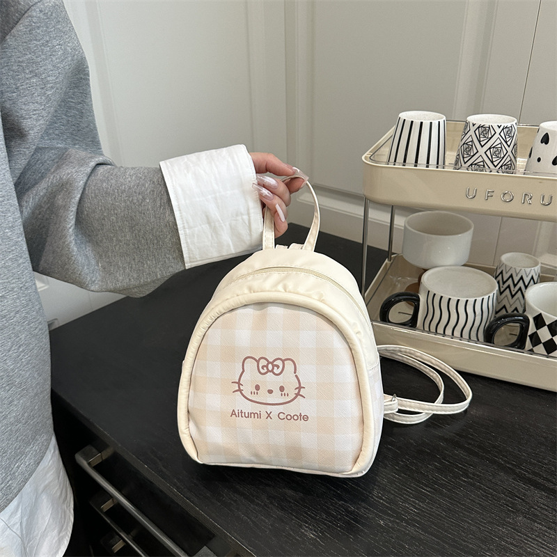 Personalidad extranjera de estilo universal, mochila de hombro para niñas, nuevo diseño de patrón de cuadrillas, mochila diaria