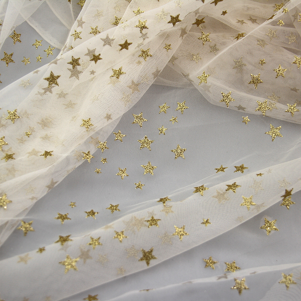 星星网纱纱帘现货布料 米黄色涤纶童装网布纱裙面料 新款小五角星