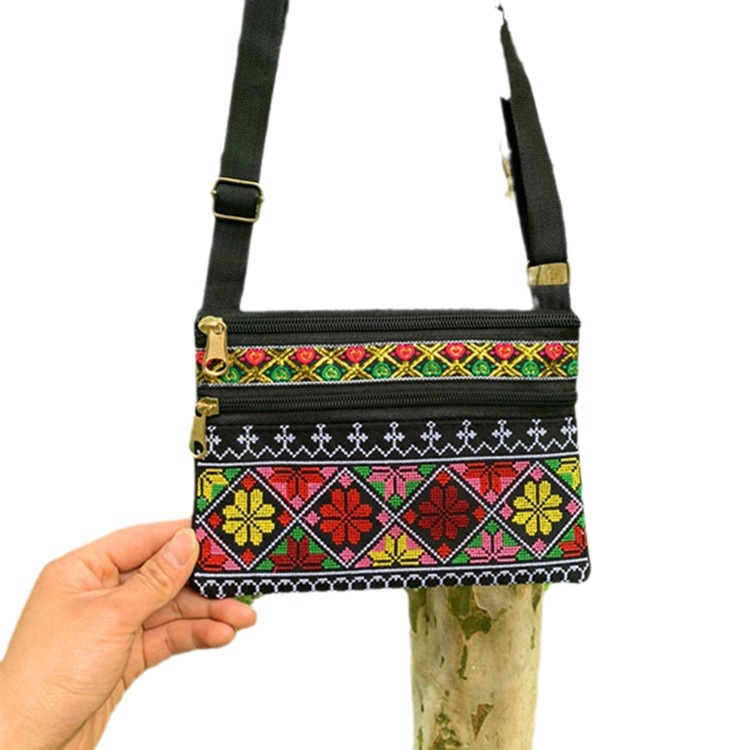 Riñonera bordada étnica de Yunnan con tres cremalleras, diseño artesanal tradicional