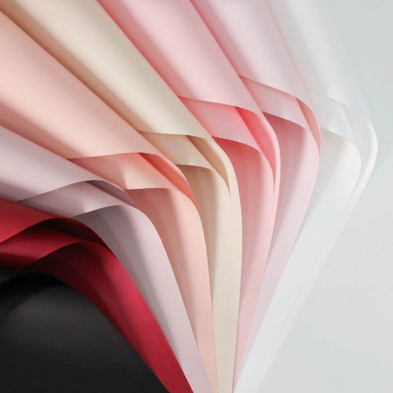 Deca papel de embalaje de flores de color sólido en stock al por mayor papel ouya impermeable material de la tienda de flores papel de embalaje material de bricolaje