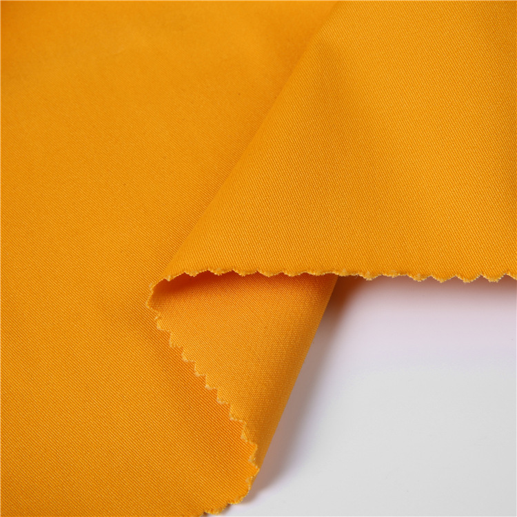 Tejido de algodón de color spandex para hombres pantalones cortos casuales tela tejida de tela de twill barata